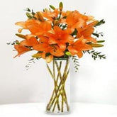 Harvest Hues: Breathtaking 10 Orange Lilies in a Glass Vase - A Taste of Autumn